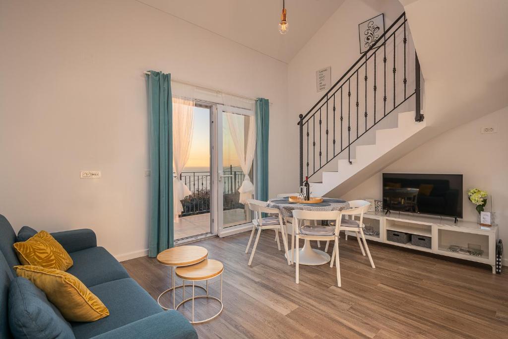 Televízia a/alebo spoločenská miestnosť v ubytovaní Apartments Villa Maria