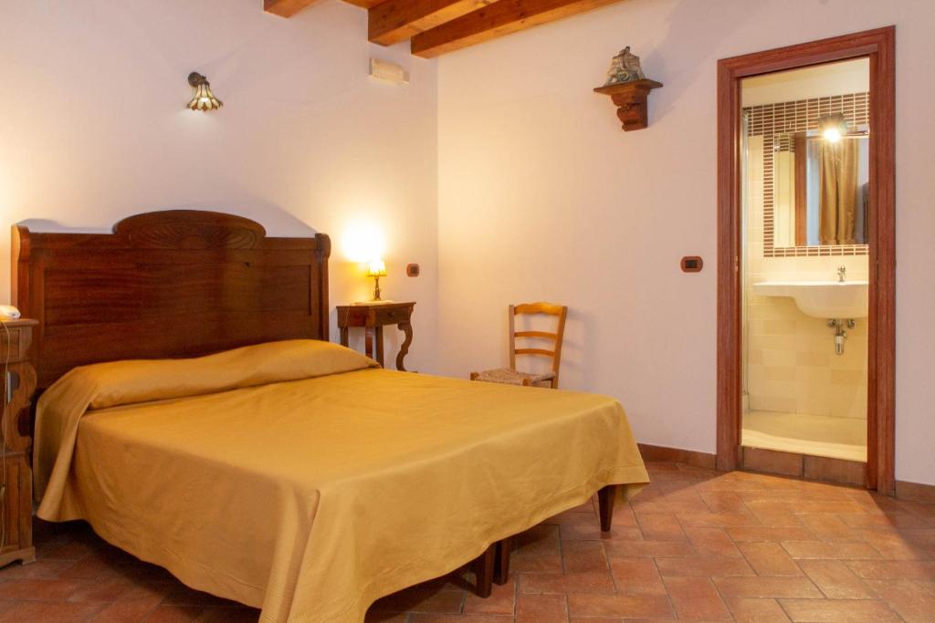 Postel nebo postele na pokoji v ubytování Donnaciccina Accomodation