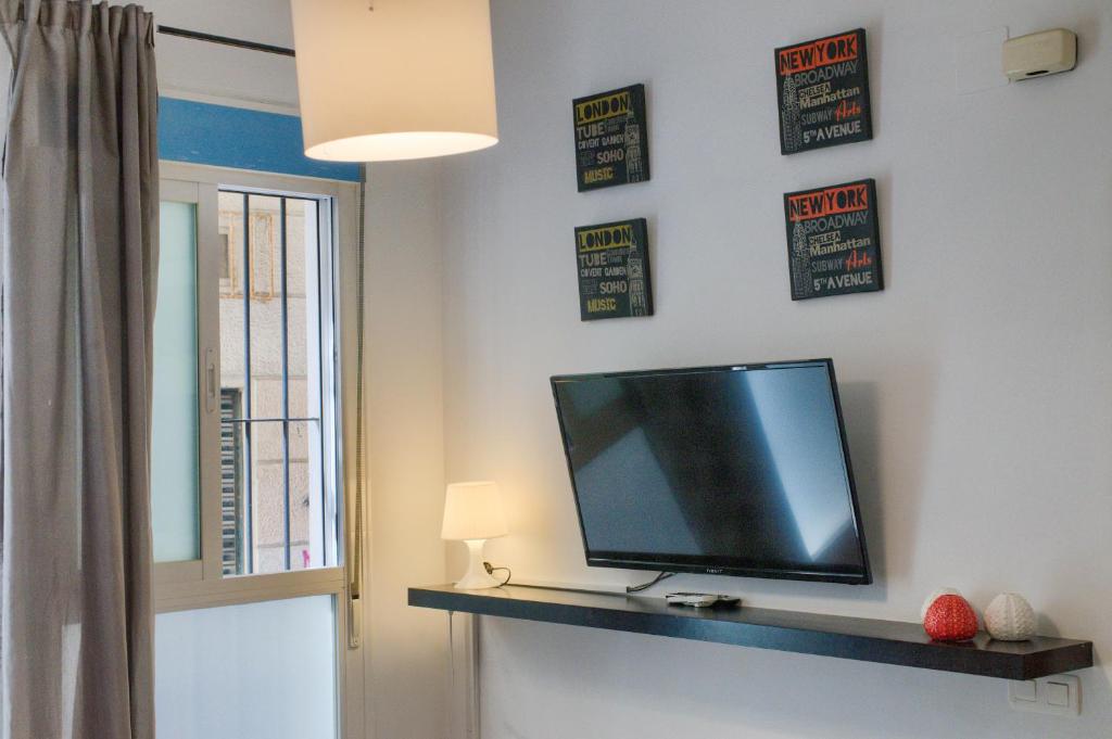 Televízia a/alebo spoločenská miestnosť v ubytovaní Novam Duplex