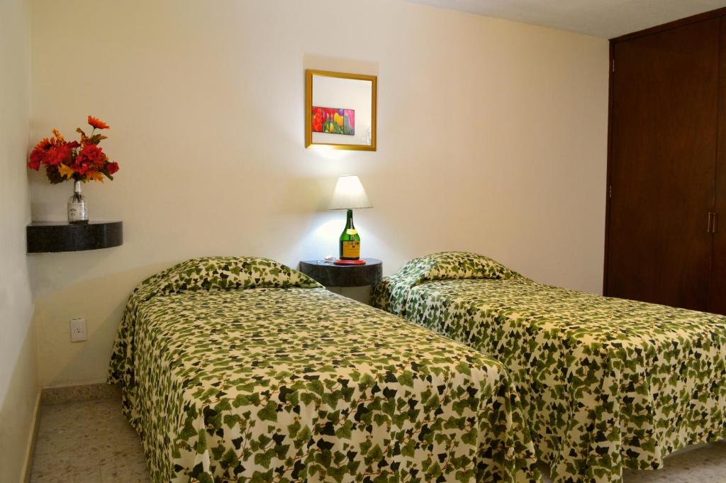 Postel nebo postele na pokoji v ubytování Hotel Sta Lucía
