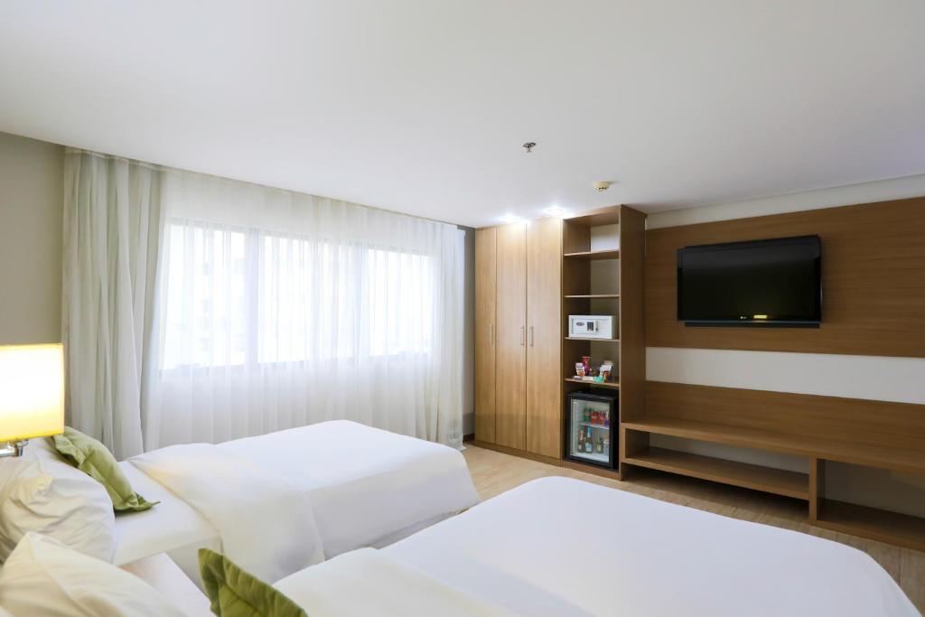 Postel nebo postele na pokoji v ubytování Radisson Hotel Belém