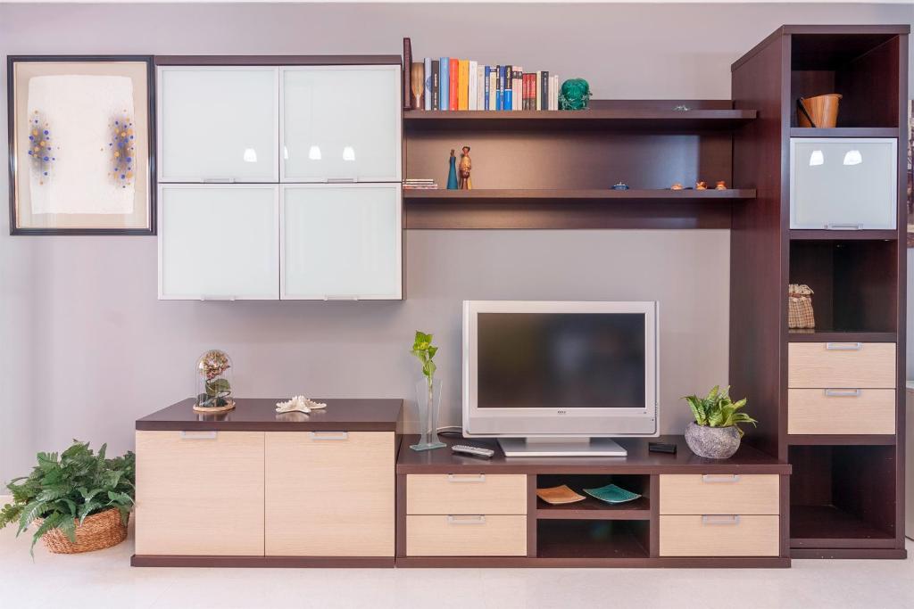 Televízia a/alebo spoločenská miestnosť v ubytovaní Residencial Vicaño VUT-PO-03856