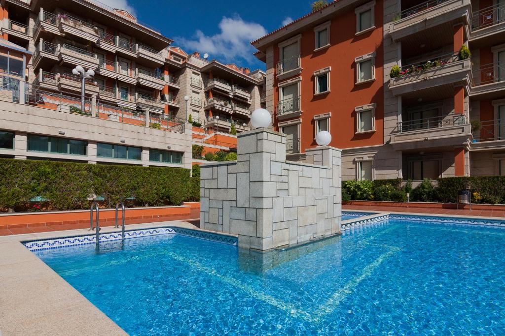 Bazén v ubytovaní Residencial Vicaño VUT-PO-03856 alebo v jeho blízkosti