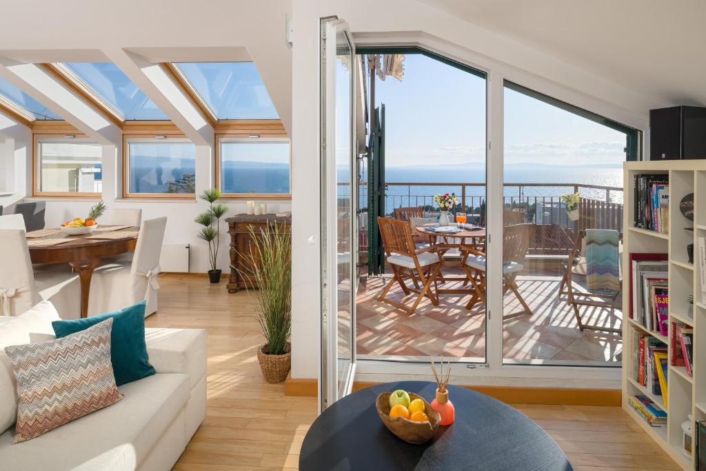 a living room with a view of the ocean at Sun Spalato Hills in Split