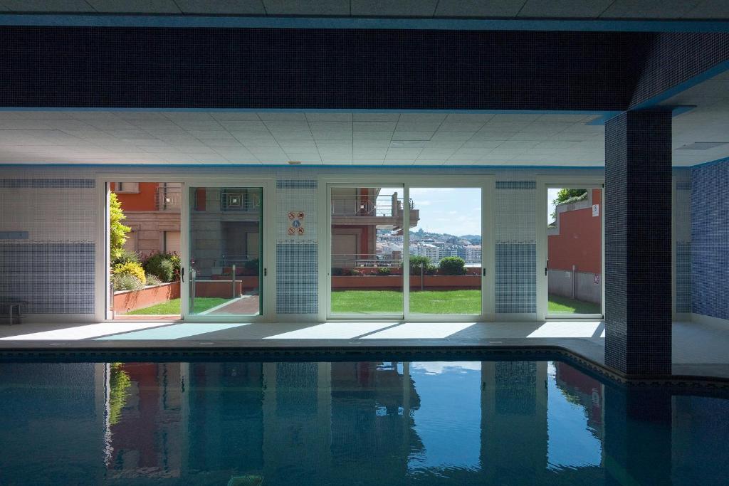 Bazén v ubytovaní Residencial Vicaño VUT-PO-03856 alebo v jeho blízkosti