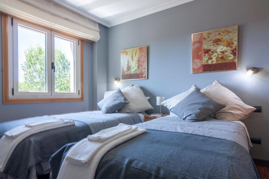 Posteľ alebo postele v izbe v ubytovaní Residencial Vicaño VUT-PO-03856