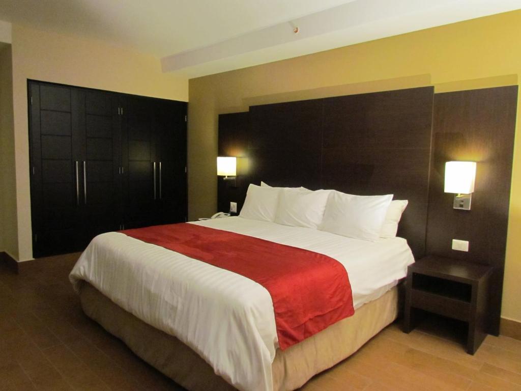 Tempat tidur dalam kamar di Hotel Principe