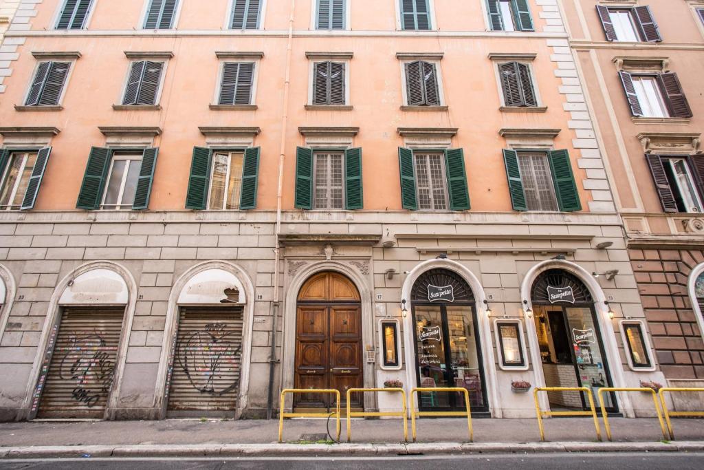 a building with doors and windows on a street at Beautiful Home in Rome