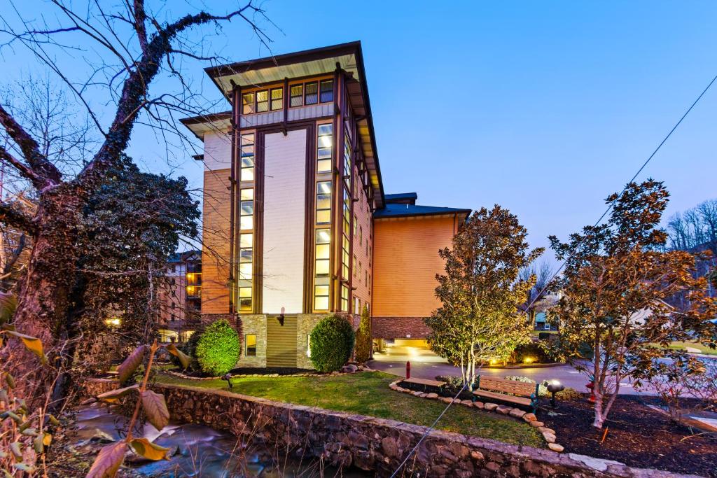a home with a tall building with lights at Baskin's Creek Condos III in Gatlinburg
