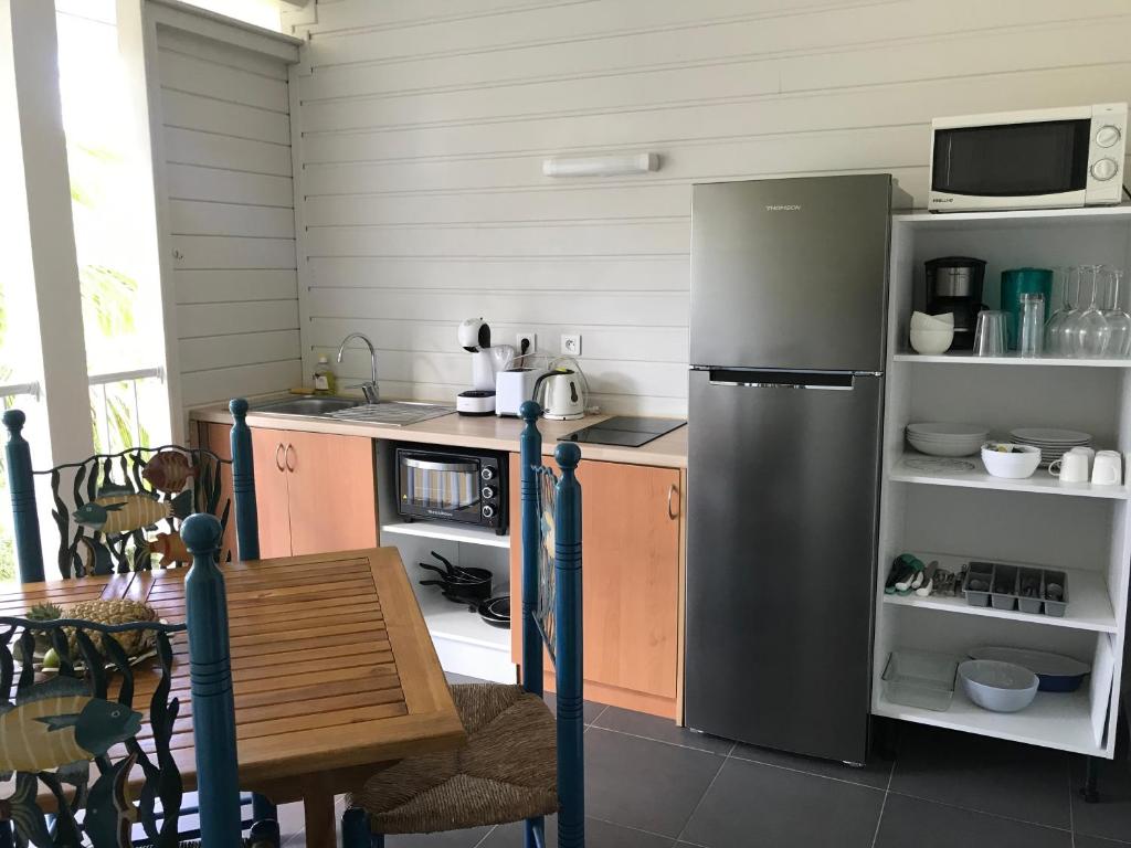 Kuchyň nebo kuchyňský kout v ubytování Appartement Duplex Vue Mer Jacuzzi Privé