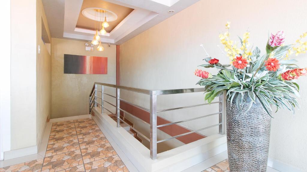 Postel nebo postele na pokoji v ubytování RedDoorz Plus near Lapasan Plaza Cagayan de Oro