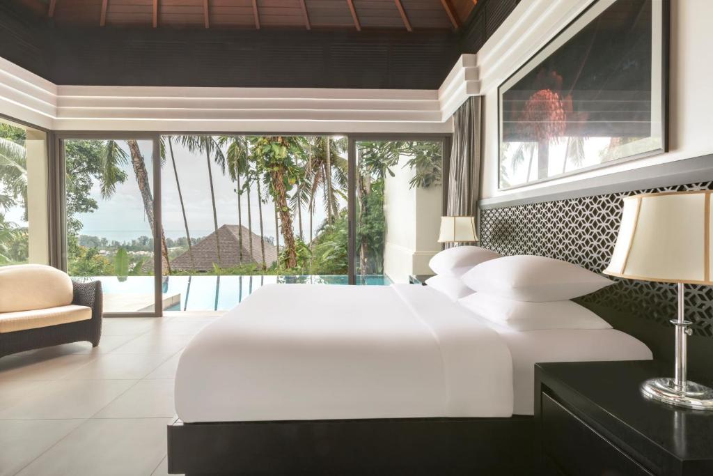 Postel nebo postele na pokoji v ubytování The Pavilions Phuket