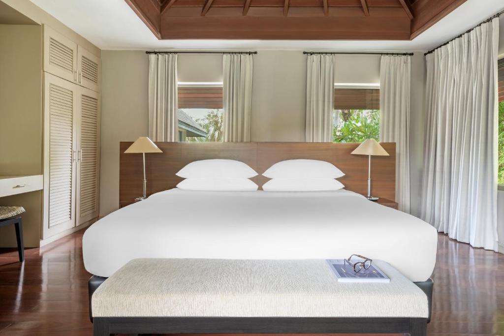 Postel nebo postele na pokoji v ubytování The Pavilions Phuket