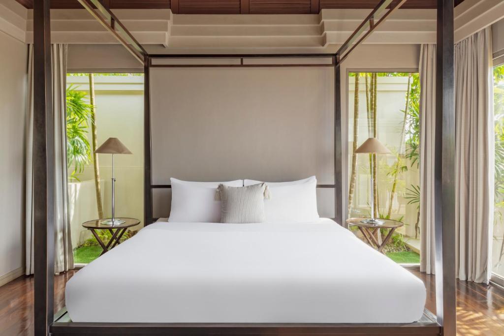 Postel nebo postele na pokoji v ubytování The Pavilions Phuket