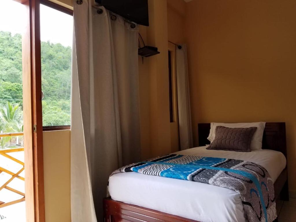 Postel nebo postele na pokoji v ubytování Hotel Soberao