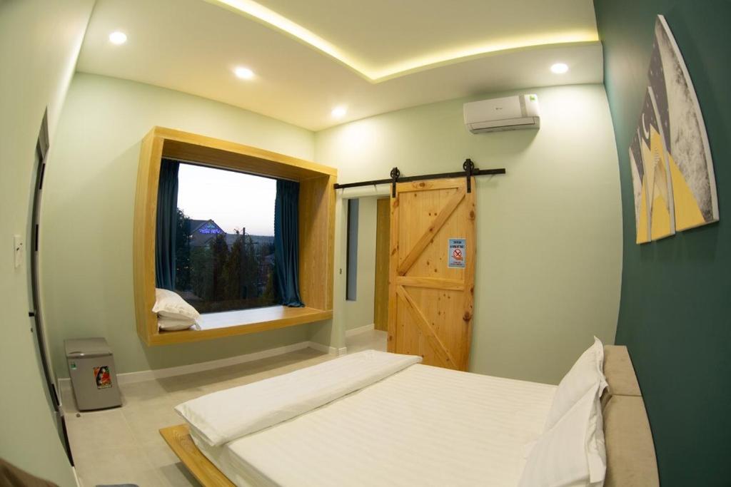 Кровать или кровати в номере Thanh Thanh Mini Hotel