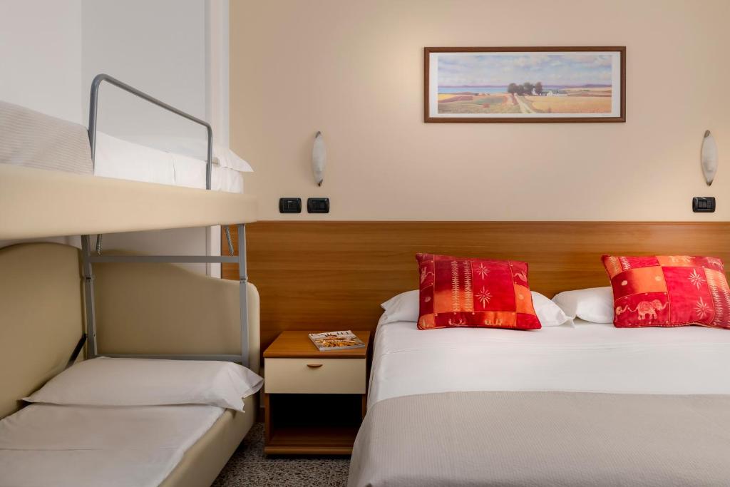 Postel nebo postele na pokoji v ubytování Hotel Maria Serena