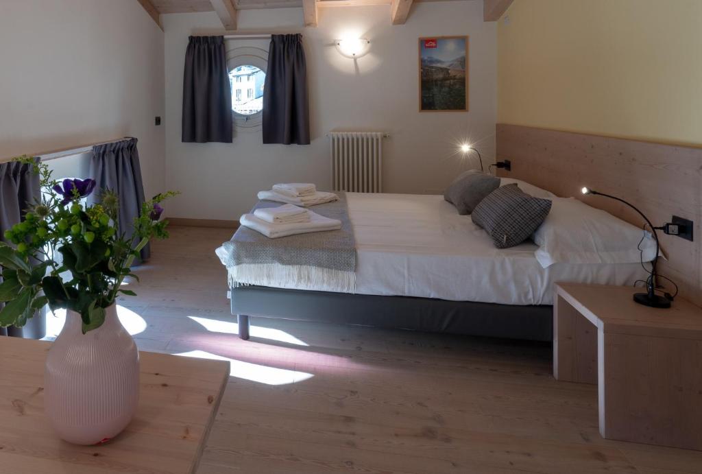 Postel nebo postele na pokoji v ubytování Marzia Lounge