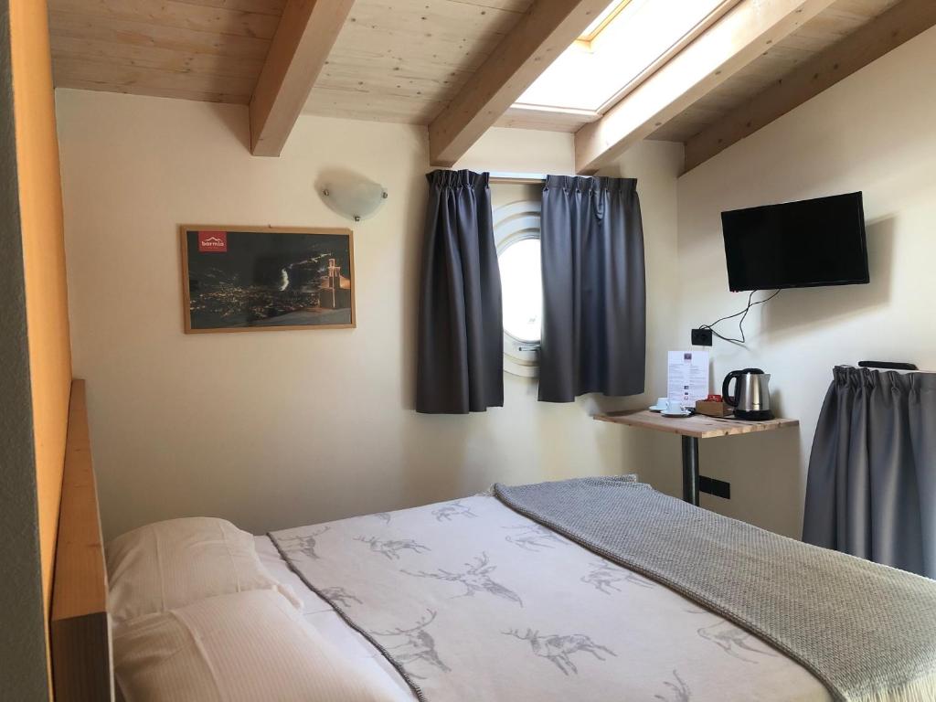 Postel nebo postele na pokoji v ubytování Marzia Lounge