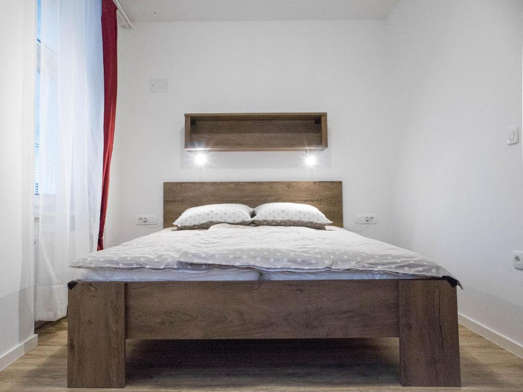 Postel nebo postele na pokoji v ubytování Jantar Apartmaji