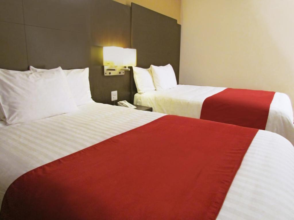 Postel nebo postele na pokoji v ubytování Hotel Principe