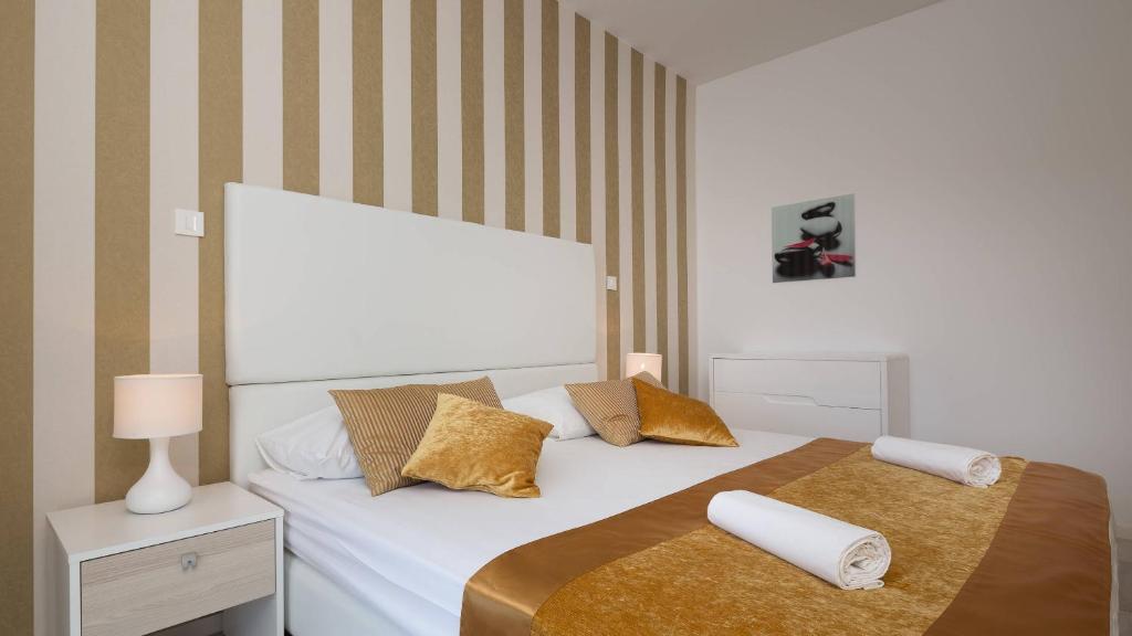 Postel nebo postele na pokoji v ubytování Perla Resort