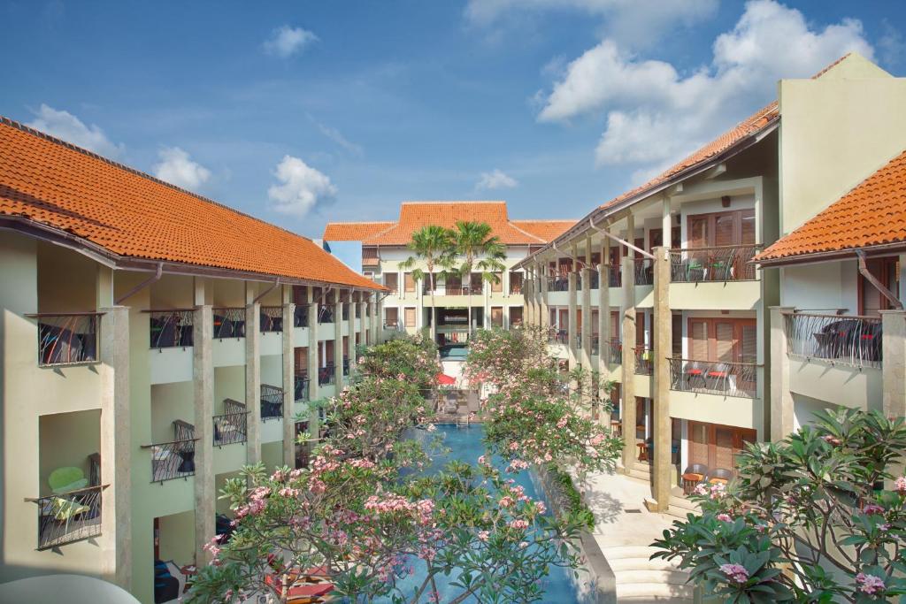an aerial view of the courtyard of a resort at ibis Styles Bali Legian - CHSE Certified in Legian