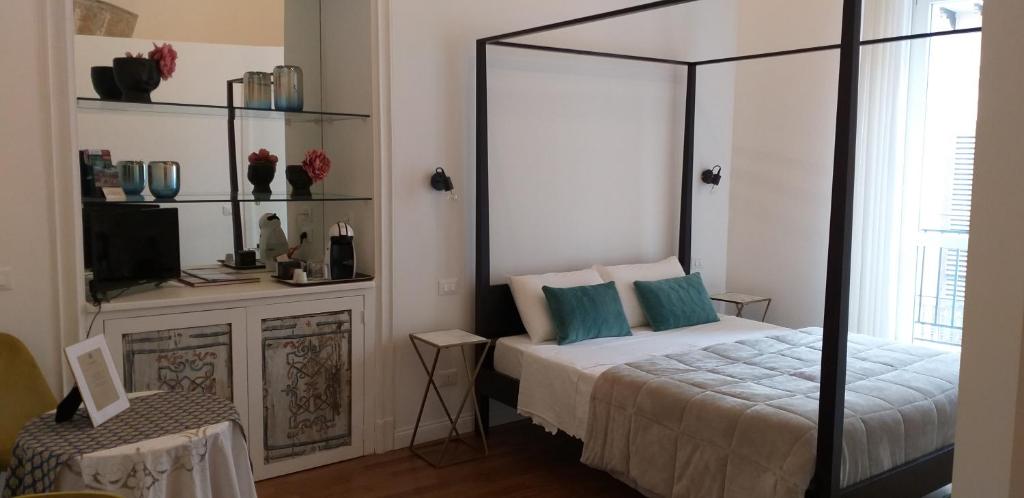 Postel nebo postele na pokoji v ubytování Il Rosone Luxury B&B