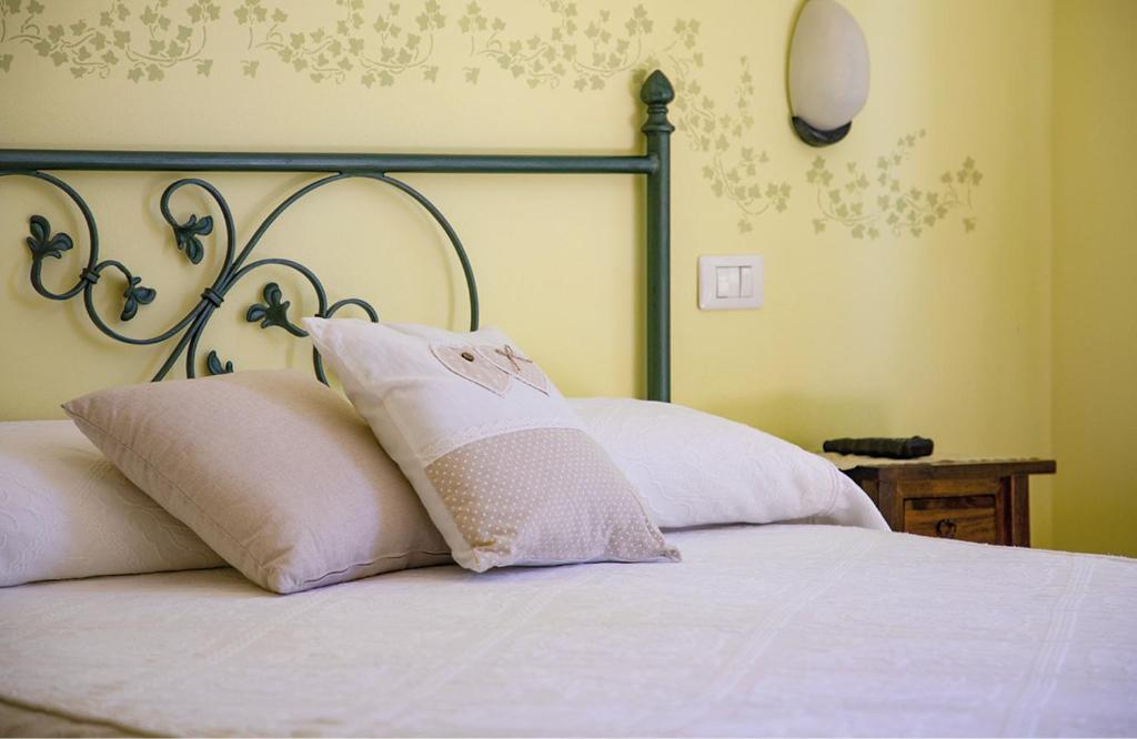 Postel nebo postele na pokoji v ubytování Agriturismo I Tre Fossi