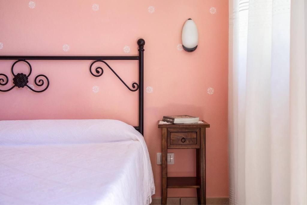 Postel nebo postele na pokoji v ubytování Agriturismo I Tre Fossi