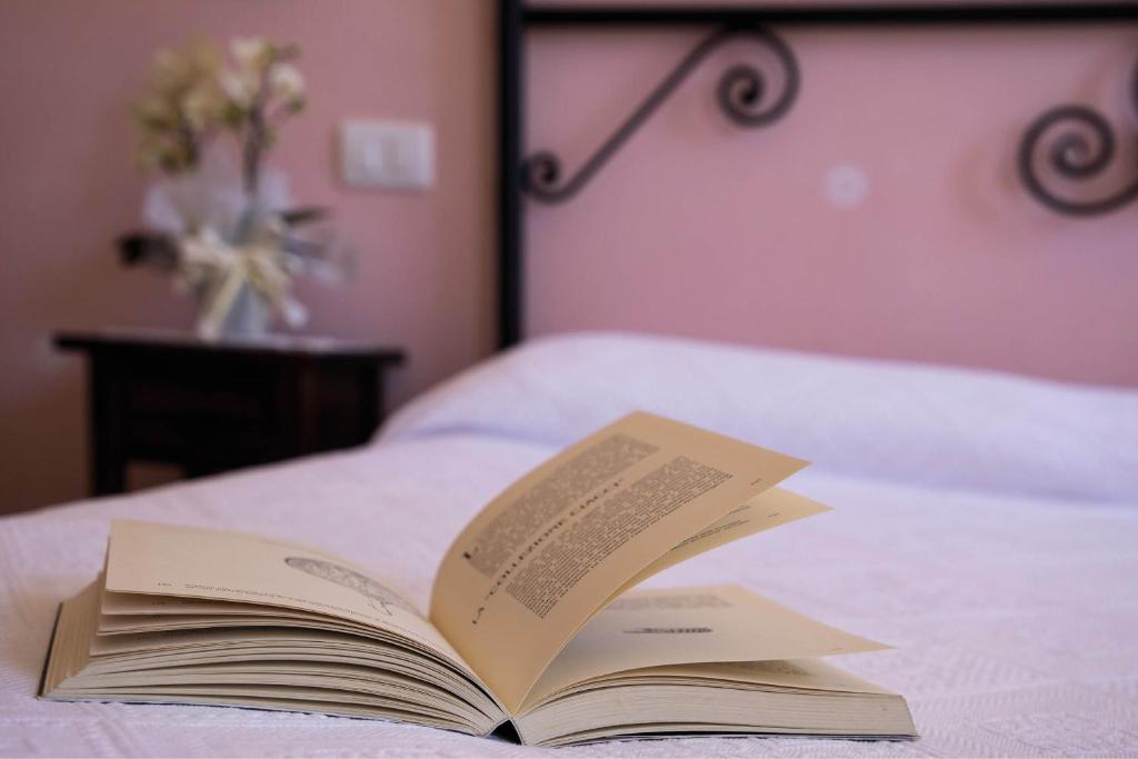 Postel nebo postele na pokoji v ubytování Agriturismo I Tre Fossi