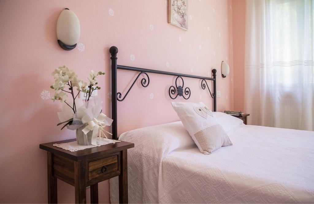 Postel nebo postele na pokoji v ubytování Agriturismo I Tre Fossi