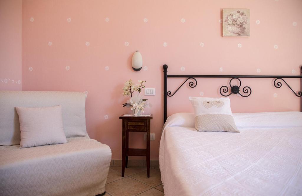 Postel nebo postele na pokoji v ubytování Agriturismo I Tre Fossi