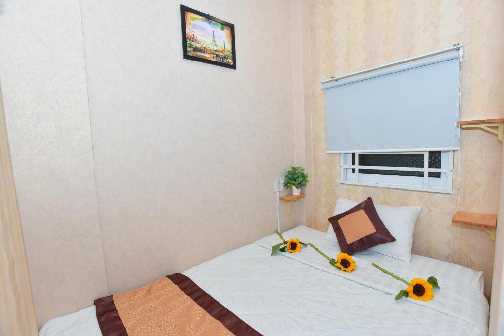 Postel nebo postele na pokoji v ubytování Winny Hotel Ninh Kieu Quay