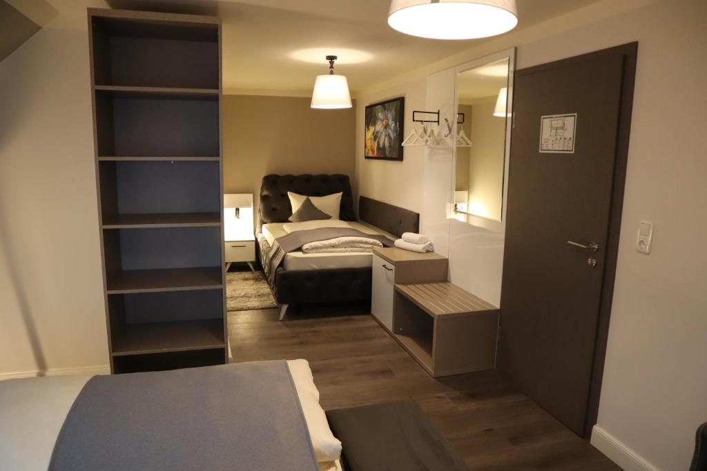 Postel nebo postele na pokoji v ubytování Hotel Bispinger Hof