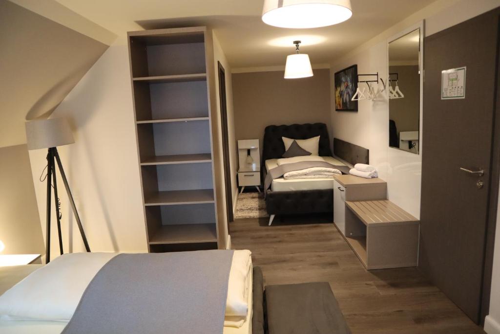Postel nebo postele na pokoji v ubytování Hotel Bispinger Hof