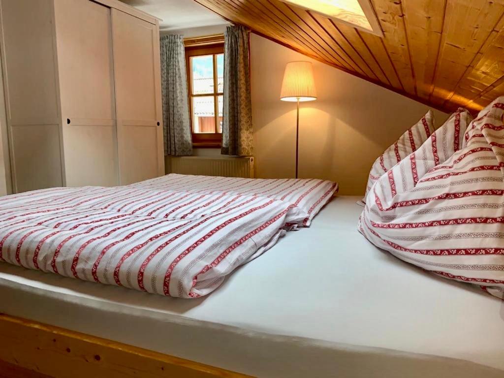A bed or beds in a room at Försterhaus Grossarl