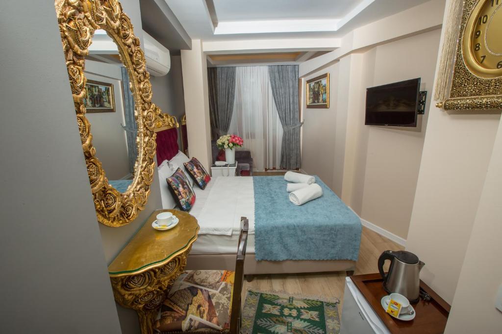 Atlantis Royal Hotelにあるテレビまたはエンターテインメントセンター