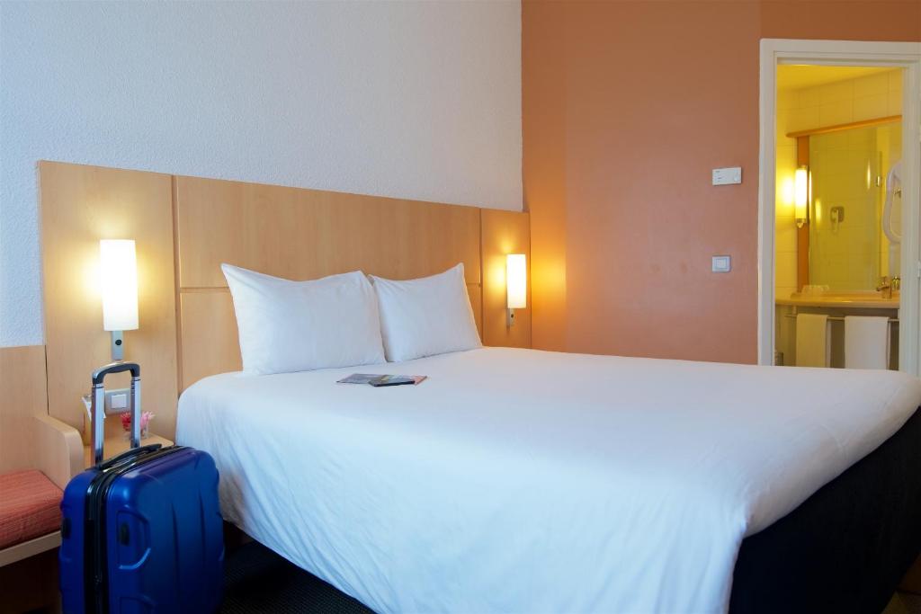 Postel nebo postele na pokoji v ubytování Ibis Cotonou