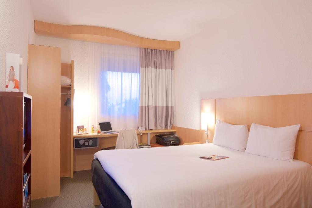 Postel nebo postele na pokoji v ubytování Ibis Cotonou