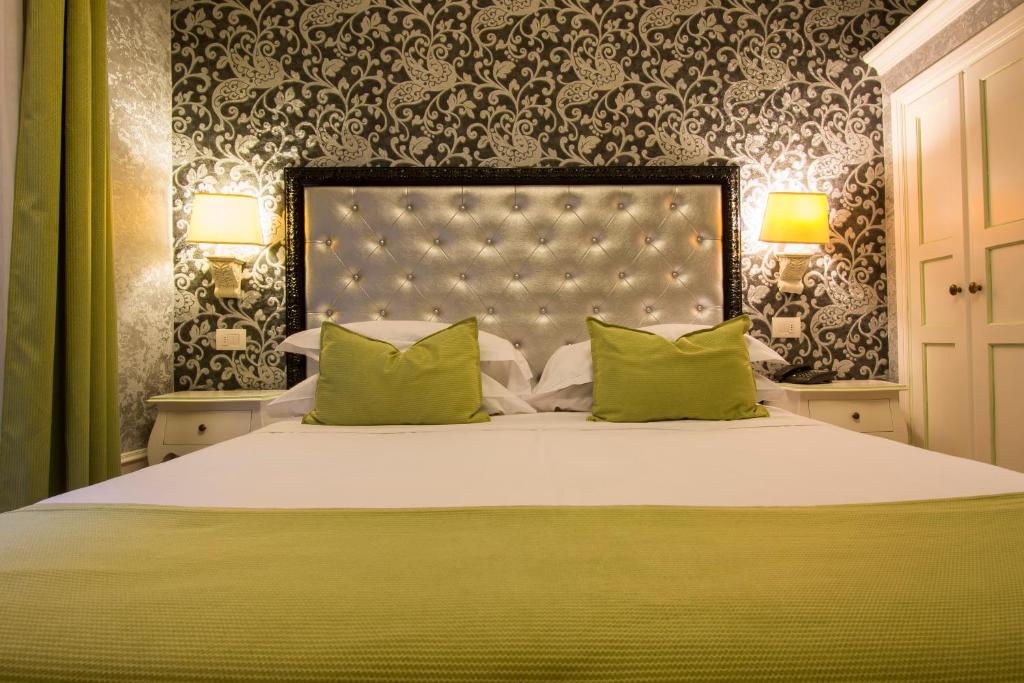 Postel nebo postele na pokoji v ubytování Hotel Pedrini