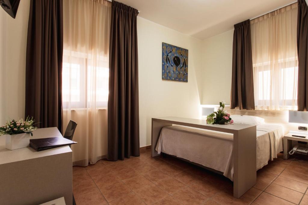 Postel nebo postele na pokoji v ubytování Hotel Fly