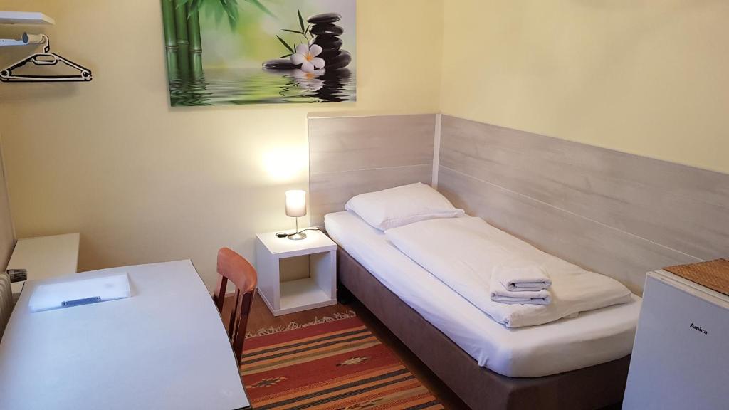 Postel nebo postele na pokoji v ubytování Gästehaus Schmitt