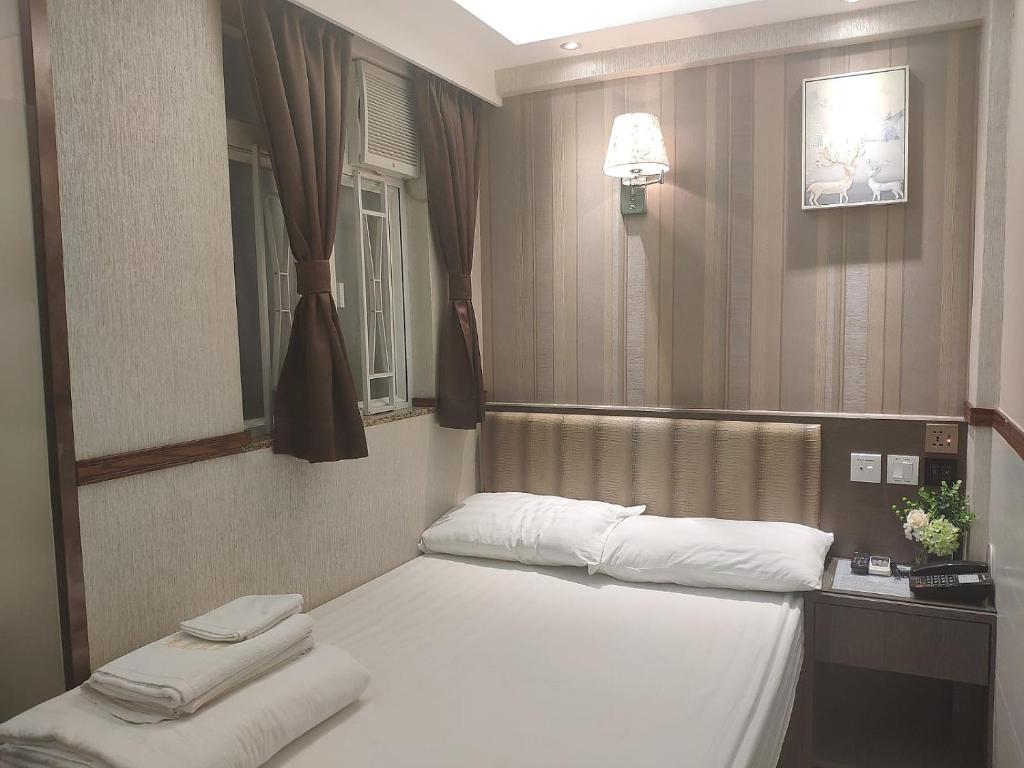Postel nebo postele na pokoji v ubytování Celltronik Hostel 先創旅店