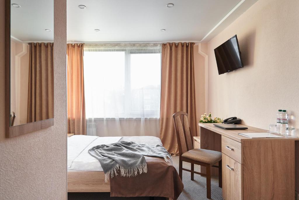 Postel nebo postele na pokoji v ubytování Hotel Druzhba