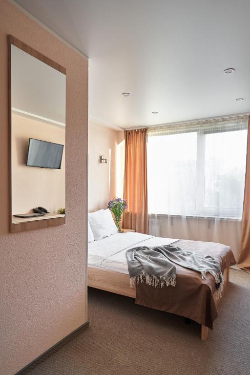 Postel nebo postele na pokoji v ubytování Hotel Druzhba