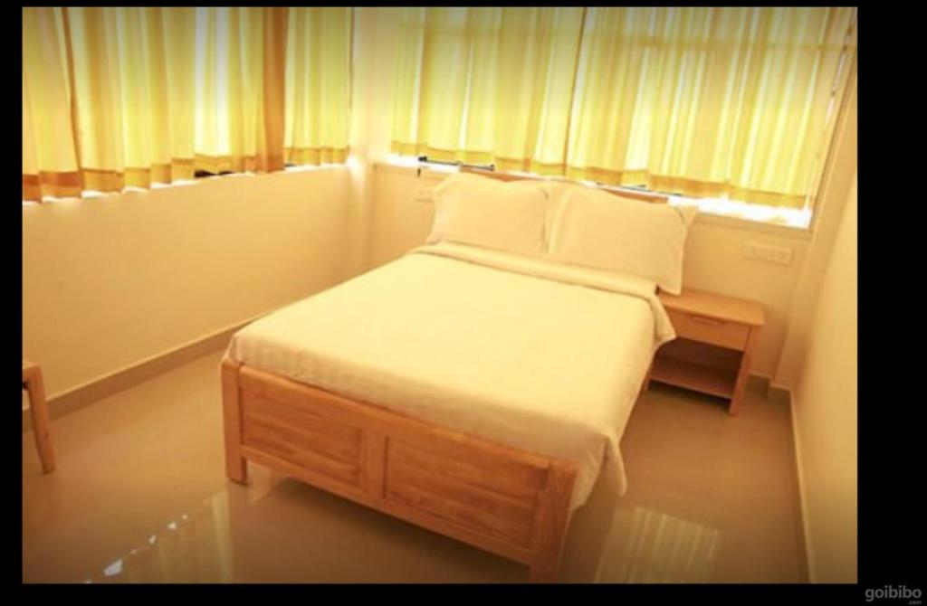 Postel nebo postele na pokoji v ubytování Hotel Tri-Star Residency