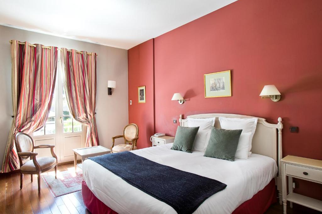 Postel nebo postele na pokoji v ubytování Château & Spa De La Commanderie