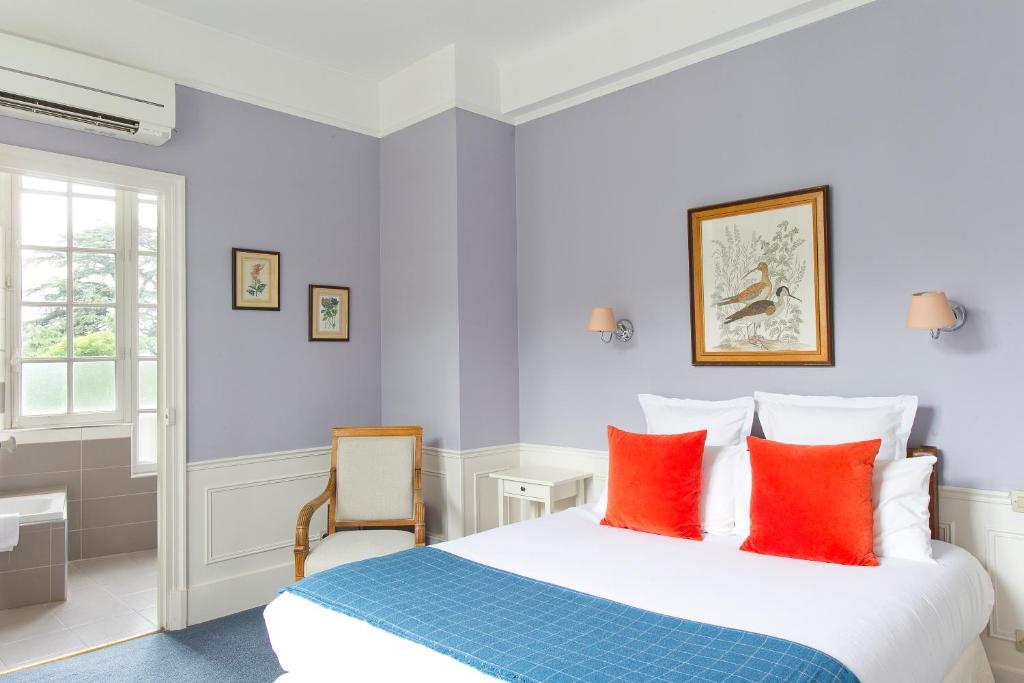 Postel nebo postele na pokoji v ubytování Château & Spa De La Commanderie