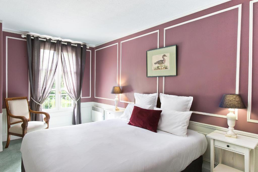 Postel nebo postele na pokoji v ubytování Château & Spa De La Commanderie